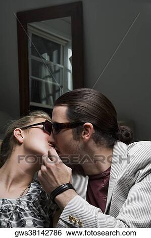 Close-up of a young couple kissing each other View Large Photo Image Stock Photograph - Close-up of a young couple kissing each other. Fotosearch