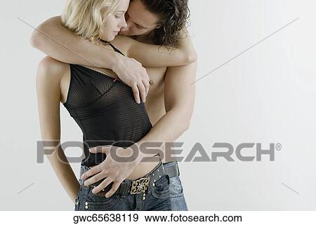 Close-up of a young couple romancing View Large Photo Image Stock Photo - Close-up of a young couple romancing. Fotosearch