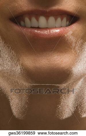 Close-up of a young man smiling View Large Photo Image Stock Photo - Close-up of a young man smiling. Fotosearch