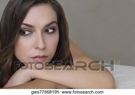 Close-up of a young woman lying on a massage table and thinking View Large Photo Image Stock Photography - Close-up of a young woman lying on a massage table and thinking. Fotosearch