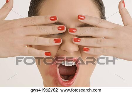 Close-up of a young woman with her messy lips View Large Photo Image Stock Image - Close-up of a young woman with her messy lips. Fotosearch