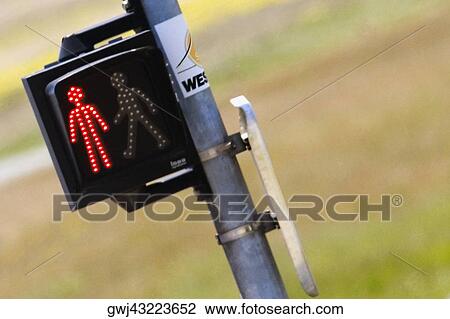 Stock Image - Close-up of an illuminated walk don't walk signal, Le Mans, France. Fotosearch