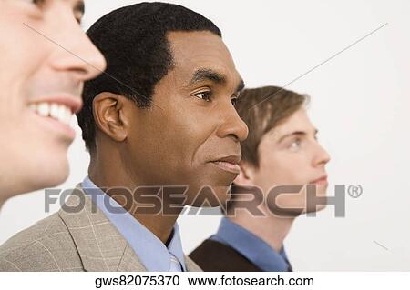 Stock Image - Close-up of business executives looking away. Fotosearch