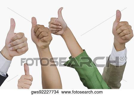 Close-up of business executives showing thumbs up sign View Large Photo Image Picture - Close-up of business executives showing thumbs up sign. Fotosearch