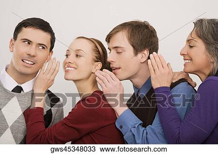 Close-up of business executives whispering to each other View Large Photo Image Stock Image - Close-up of business executives whispering to each other. Fotosearch