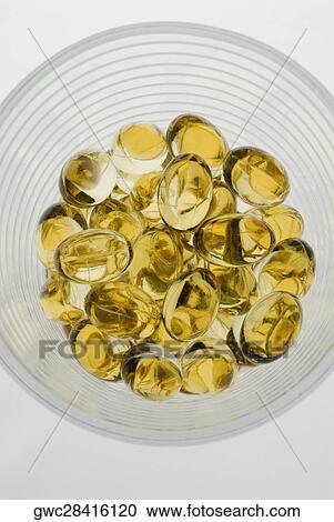 Close-up of capsules in a glass bowl View Large Photo Image Stock Image - Close-up of capsules in a glass bowl. Fotosearch