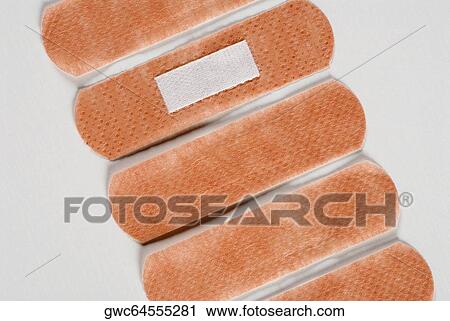 Close-up of five adhesive bandages View Large Photo Image Stock Image - Close-up of five adhesive bandages. Fotosearch