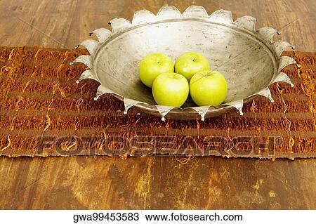 Close-up of four apples in a bowl on a dining table View Large Photo Image Stock Image - Close-up of four apples in a bowl on a dining table. Fotosearch