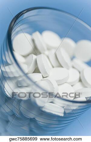 Close-up of pills in a glass View Large Photo Image Stock Photo - Close-up of pills in a glass. Fotosearch