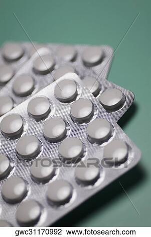 Close-up of pills in blister packs View Large Photo Image Stock Image - Close-up of pills in blister packs. Fotosearch