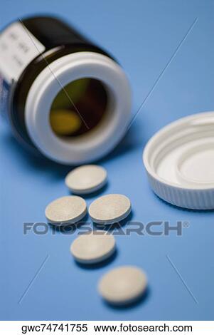 Close-up of pills with a bottle View Large Photo Image Stock Photography - Close-up of pills with a bottle. Fotosearch