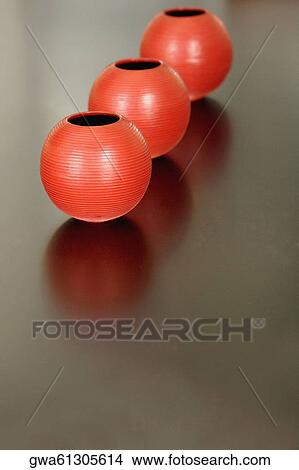 Picture - Close-up of three ceramic pots on a table. Fotosearch