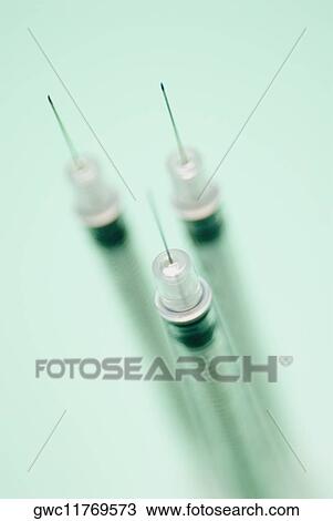 Close-up of three syringes View Large Photo Image Stock Image - Close-up of three syringes. Fotosearch