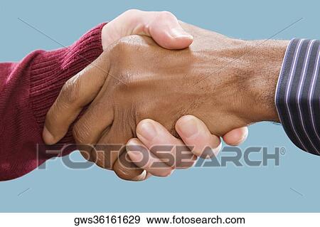 Close-up of two businessmen's shaking hands View Large Photo Image Stock Photo - Close-up of two businessmen's shaking hands. Fotosearch