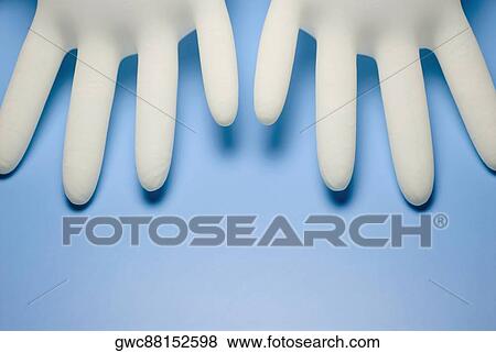 Close-up of two surgical gloves View Large Photo Image Stock Photo - Close-up of two surgical gloves. Fotosearch