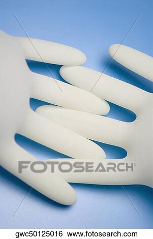 Close-up of two surgical gloves View Large Photo Image Stock Photograph - Close-up of two surgical gloves. Fotosearch
