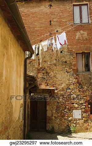 Clothes hanging to dry on a clothesline, Monteriggioni, Siena Province, Tuscany, Italy View Large Photo Image Stock Photo - Clothes hanging to dry on a clothesline, Monteriggioni, Siena Province, Tuscany, Italy. Fotosearch