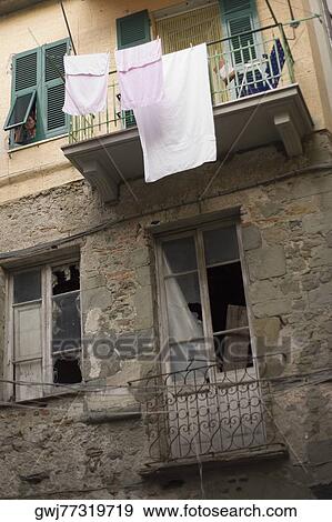 Clothes hanging to dry on a clothesline, Cinque Terre, La Spezia, Liguria, Italy View Large Photo Image Stock Photo - Clothes hanging to dry on a clothesline, Cinque Terre, La Spezia, Liguria, Italy. Fotosearch