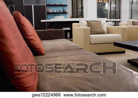 Couch and armchairs in a living room View Large Photo Image Stock Photograph - Couch and armchairs in a living room. Fotosearch