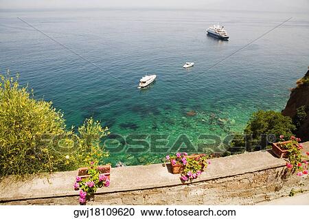 Cruise ship and boats in the sea, Bay of Naples, Sorrento, Sorrentine Peninsula, Naples Province, Campania, Italy View Large Photo Image Stock Image - Cruise ship and boats in the sea, Bay of Naples, Sorrento, Sorrentine Peninsula, Naples Province, Campania, Italy. Fotosearch