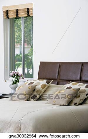 Cushions and pillows on the bed View Large Photo Image Picture - Cushions and pillows on the bed. Fotosearch