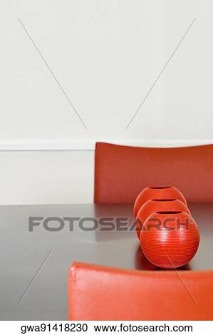 Decorative urns on a dining table in a dining room View Large Photo Image Stock Image - Decorative urns on a dining table in a dining room. Fotosearch