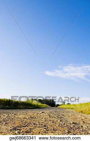 Dirt road passing through a field, Loire Valley, France View Large Photo Image Stock Image - Dirt road passing through a field, Loire Valley, France. Fotosearch