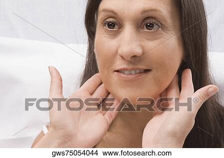 Doctor examining a mature woman View Large Photo Image Picture - Doctor examining a mature woman. Fotosearch