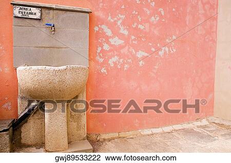 Drinking fountain on a wall, Cinque Terre, Manarola, La Spezia, Liguria, Italy View Large Photo Image Stock Image - Drinking fountain on a wall, Cinque Terre, Manarola, La Spezia, Liguria, Italy. Fotosearch
