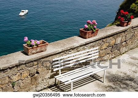 Empty bench at seaside, Bay of Naples, Sorrento, Sorrentine Peninsula, Naples Province, Campania, Italy View Large Photo Image Stock Photography - Empty bench at seaside, Bay of Naples, Sorrento, Sorrentine Peninsula, Naples Province, Campania, Italy. Fotosearch