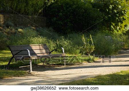 Empty bench in a park, Le Mans, Sarthe, Pays-de-la-Loire, France View Large Photo Image Stock Image - Empty bench in a park, Le Mans, Sarthe, Pays-de-la-Loire, France. Fotosearch