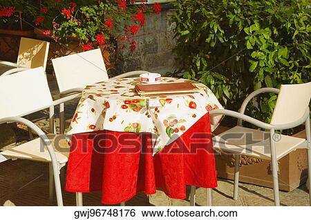 Empty chairs at a sidewalk cafe, Piazza della Cisterna, San Gimignano, Siena Province, Tuscany, Italy View Large Photo Image Stock Photograph - Empty chairs at a sidewalk cafe, Piazza della Cisterna, San Gimignano, Siena Province, Tuscany, Italy. Fotosearch