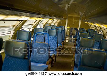 Stock Photo - Empty seats in a train, Liguria, Italy. Fotosearch
