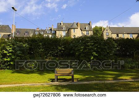 Empty wooden bench in a park, Le Mans, Sarthe, Pays-de-la-Loire, France View Large Photo Image Stock Photograph - Empty wooden bench in a park, Le Mans, Sarthe, Pays-de-la-Loire, France. Fotosearch