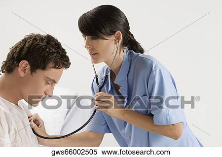 Female doctor examining a patient View Large Photo Image Stock Photography - Female doctor examining a patient. Fotosearch