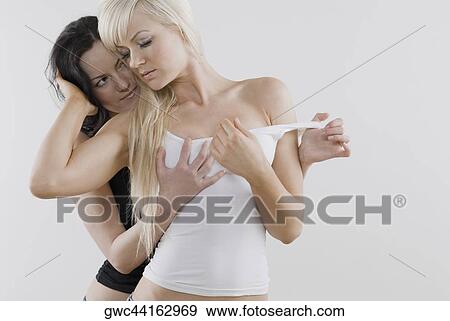 Female homosexual couple embracing each other View Large Photo Image Stock Photo - Female homosexual couple embracing each other. Fotosearch