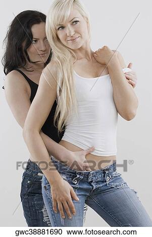 Stock Image - Female homosexual couple romancing. Fotosearch