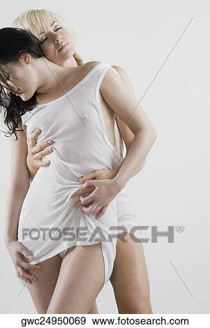 Female homosexual couple romancing View Large Photo Image Stock Photo - Female homosexual couple romancing. Fotosearch