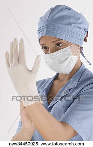 Female surgeon holding a syringe View Large Photo Image Stock Photography - Female surgeon holding a syringe. Fotosearch