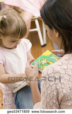 Female teacher teaching her student View Large Photo Image Stock Photo - Female teacher teaching her student. Fotosearch