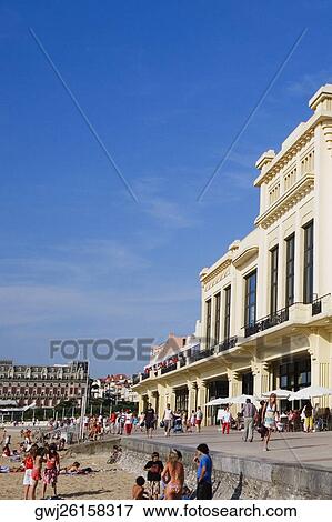 Group of people in front of a hotel, Casino Municipal, Hotel Du Palais, Grande Plage, Biarritz, France View Large Photo Image Stock Photo - Group of people in front of a hotel, Casino Municipal, Hotel Du Palais, Grande Plage, Biarritz, France. Fotosearch