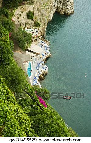 High angle view of a boat floating on water, Costiera Amalfitana, Salerno, Campania, Italy View Large Photo Image Stock Photo - High angle view of a boat floating on water, Costiera Amalfitana, Salerno, Campania, Italy. Fotosearch
