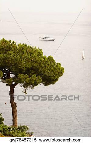 Stock Photography - High angle view of a cruise ship and a sailboat in the sea, Positano, Amalfi Coast, Salerno, Campania, Italy. Fotosearch