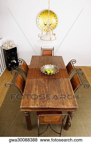 Stock Photo - High angle view of a dining table in a dining room. Fotosearch