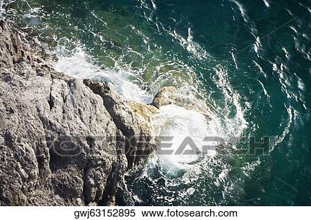 High angle view of a rock formation at the seaside, Costiera Amalfitana, Salerno, Campania, Italy View Large Photo Image Stock Photography - High angle view of a rock formation at the seaside, Costiera Amalfitana, Salerno, Campania, Italy. Fotosearch
