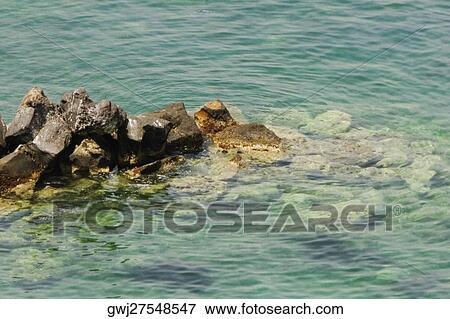 High angle view of a rock formation in the sea, Bay of Naples, Sorrento, Sorrentine Peninsula, Naples Province, Campania, Italy View Large Photo Image Stock Photo - High angle view of a rock formation in the sea, Bay of Naples, Sorrento, Sorrentine Peninsula, Naples Province, Campania, Italy. Fotosearch