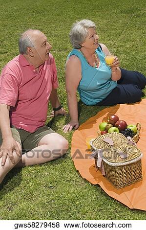 High angle view of a senior couple at a picnic View Large Photo Image Stock Photo - High angle view of a senior couple at a picnic. Fotosearch