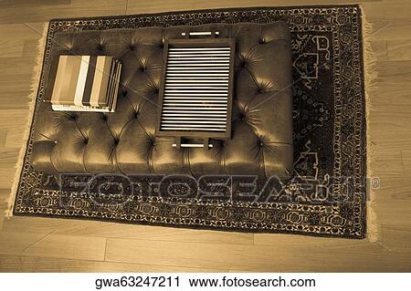 High angle view of a serving tray and towels on a table in a living room View Large Photo Image Stock Image - High angle view of a serving tray and towels on a table in a living room. Fotosearch