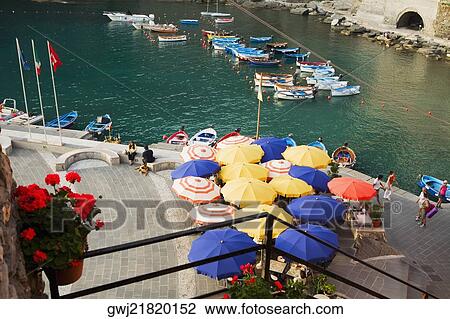 High angle view of a sidewalk cafe at a riverside, Italian Riviera, Cinque Terre National Park, Vernazza, La Spezia, Liguria, Italy View Large Photo Image Stock Image - High angle view of a sidewalk cafe at a riverside, Italian Riviera, Cinque Terre National Park, Vernazza, La Spezia, Liguria, Italy. Fotosearch