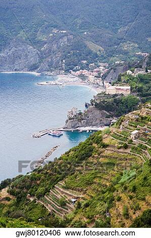 High angle view of a town at the sea side, Ligurian Sea, Italian Riviera, Cinque Terre, La Spezia, Liguria, Italy View Large Photo Image Stock Photograph - High angle view of a town at the sea side, Ligurian Sea, Italian Riviera, Cinque Terre, La Spezia, Liguria, Italy. Fotosearch